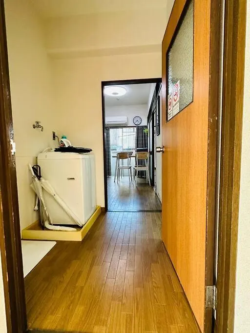 A Traditional Home With A View Of Tsutenkaku Osaka Japan